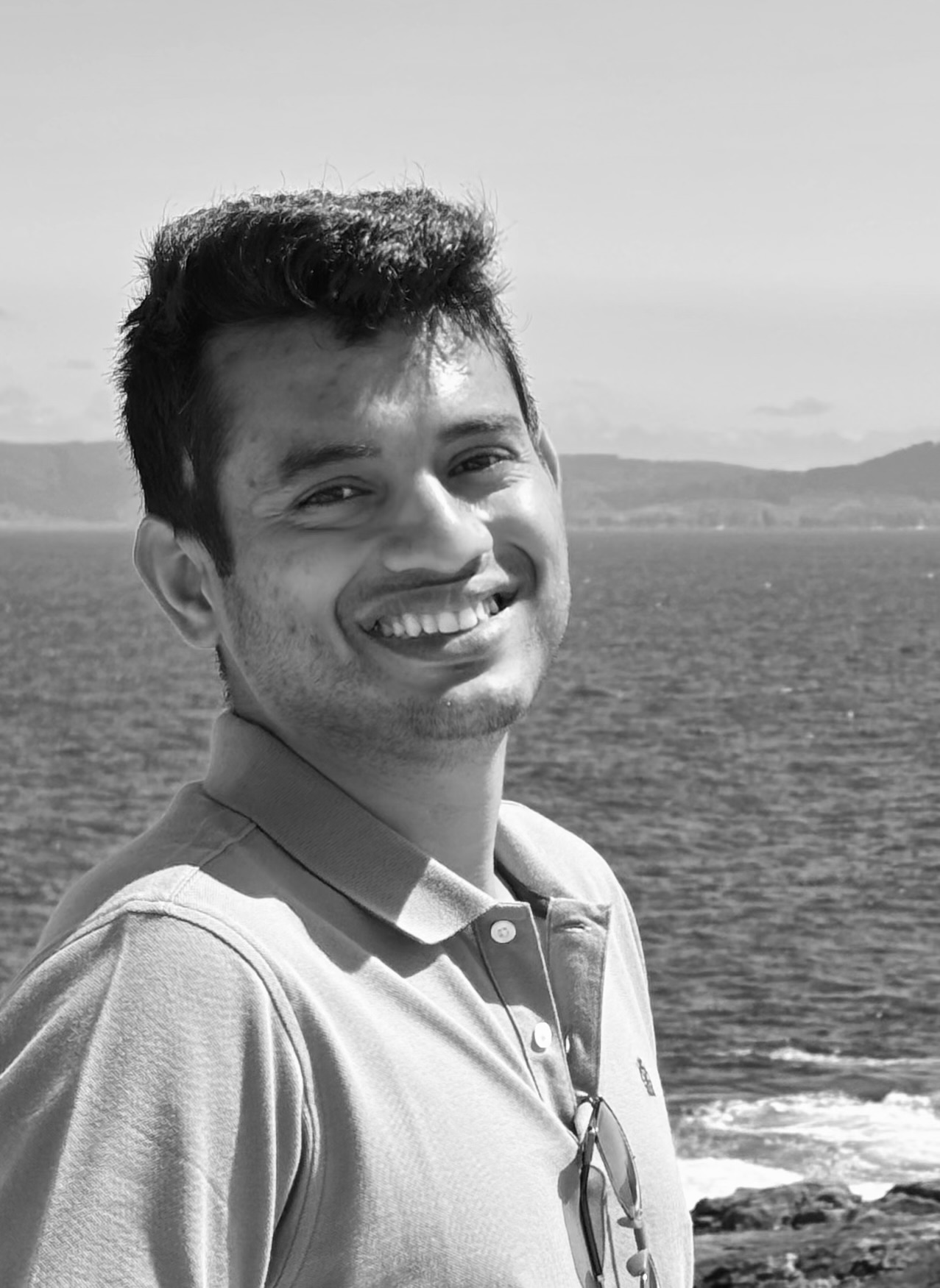 professional headshot portrait of a software engineer, minimalist background, black and white aesthetic